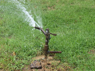 A spring loaded water sprinkler head that has been used on golf courses for years is now appearing in large yards and landscaped areas 