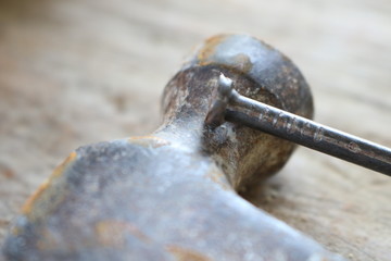 Spikes and hammers on a wooden table