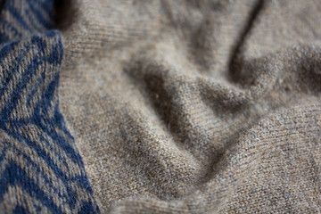 the texture of a knitted sweater, close up warm woollen clothing