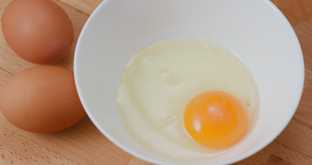 Breaking egg in bowl