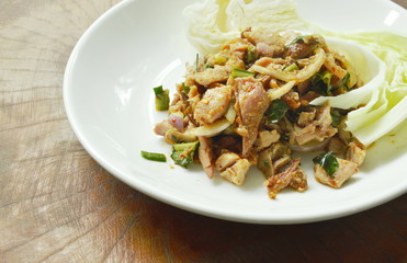 spicy grilled chicken Thai salad eat with cabbage on plate