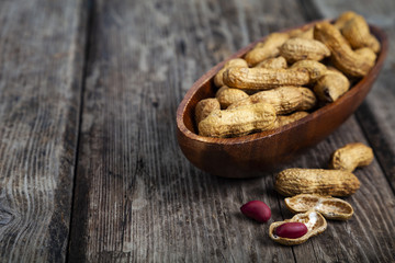 Peanuts in a wooden bowl