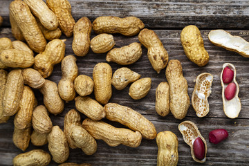 Peanuts on a wooden background.