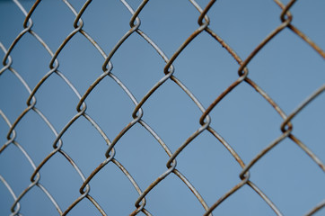 Fototapeta premium Rust iron net on blue backgound