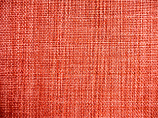 Texture of red linen or nylon fabric texture.