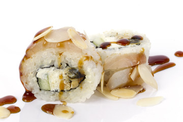 Sushi rolls japanese food isolated on white background.California Sushi roll with tuna, vegetables and unagi sauce closeup.Japanese Restaurant Menu.