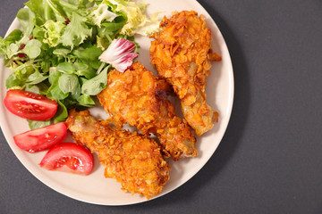 fried chicken leg and salad