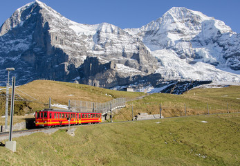 Fototapeta na wymiar The Jungfrau seen from Mürren, red train, panoramic, Switzerland 