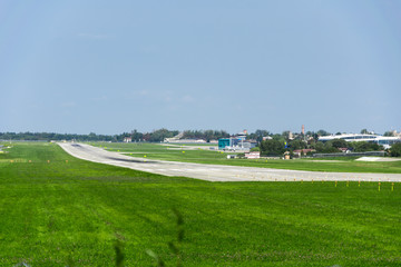 runway, green grass, blue sky