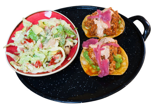 Image Of Tasty Chicken Salad With Avocado And Tuna Tostada