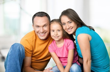 Happy cheerful family on background