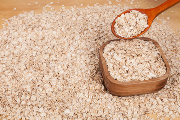 oat flakes on wooden background