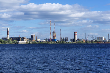 Fototapeta na wymiar industrial zone on the coast behind a vast water area, a general view