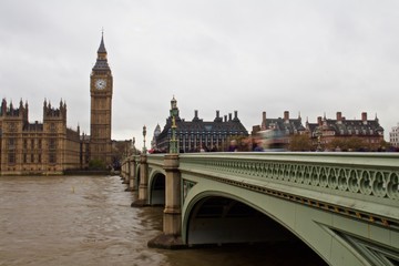 Obraz na płótnie Canvas Tourists Walk Past Big Ben in London Across the Thames