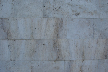 stone wall of gray rectangular blocks