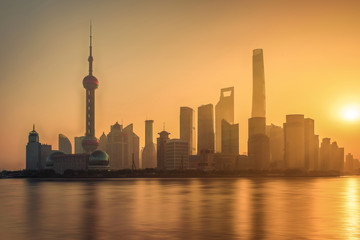 Fototapeta premium Moring view of shanghai skyline and huangpu river with sunrise glow