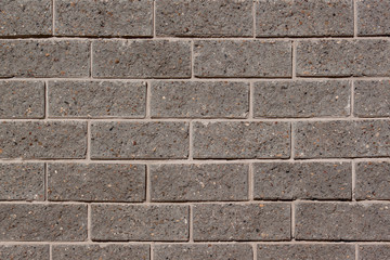 Brick wall with many gray bricks. Used as a background.