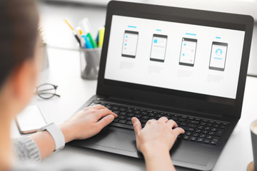 app design, technology and business concept - web designer or developer with templates on laptop...