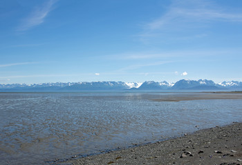 Several volcanic peaks across Cook Inlet in Homer Alaska