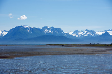 Several volcanic peaks across Cook Inlet in Homer Alaska
