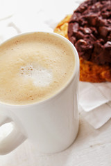 cappuccino coffee with artisan cookie