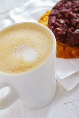 cappuccino coffee with artisan cookie