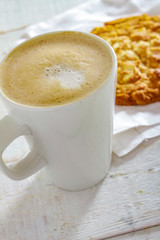 cappuccino coffee with artisan cookie