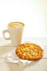 cappuccino coffee with artisan cookie