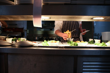 plating food in kitchen