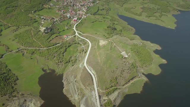 Aerial view of highway road in Techniti Limni Smokovou lake in Greece.
