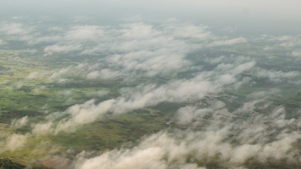A soft mist floats on a green pasture