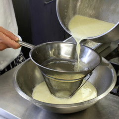 chef making panna cotta