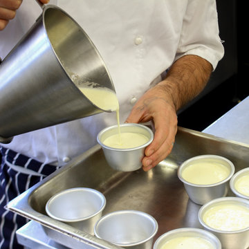 chef making panna cotta