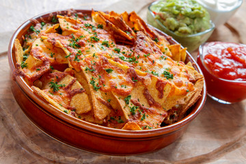 baked nacho chips with dips