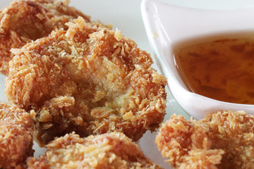 Homemade roasted beef pork fish meatballs shrimp balls cheese balls in white plate and sweet sauce at fresh market in Phuket, Thailand