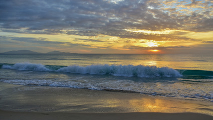 Fototapeta na wymiar Sea waves and beautiful sunset