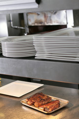 cooking fresh steak in kitchen