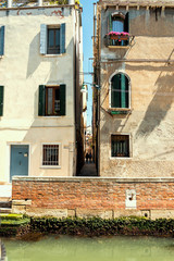 Fototapeta na wymiar Little alley in the medieval center of Venice