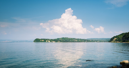 Seascape with a reflection of a cloud on a water