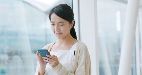 Obraz premium Woman use of mobile phone in the airport