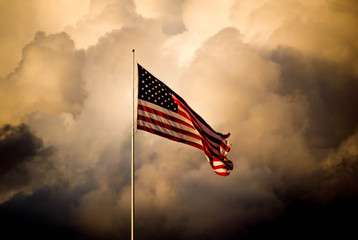 The American flag flies high as a storm approaches