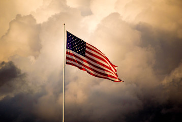 The American flag flies high as a storm approaches
