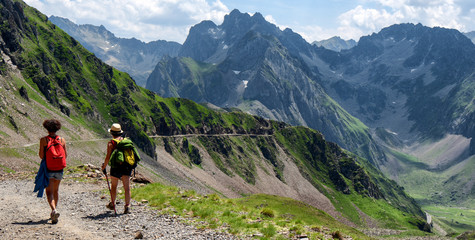 Fototapeta na wymiar two women hikers on the trail of Pic du Midi de Bigorre in the Pyrenees