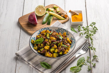 red rice salad with chicken zucchinis and tumeric