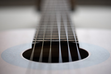 Fototapeta premium Detail of acoustic guitar - shallow depth of field