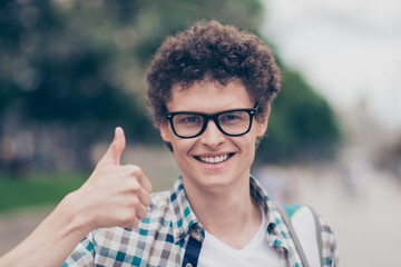 Portrait of curly haired cute attractive handsome smiling guy we