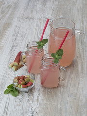 fruit juice from rhubarb on a wooden table. 