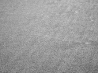 close up sand ground floor at the sea beach in black and white color