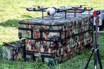 Military drone equipment at air show.
