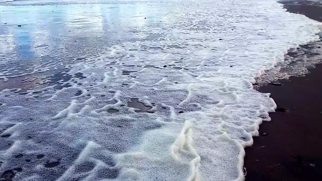 White Sea Foam In The Baltic Sea Beach